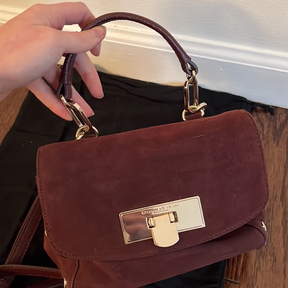 Donna Karan burgundy/oxblood suede cross body bag with top handle. Never used